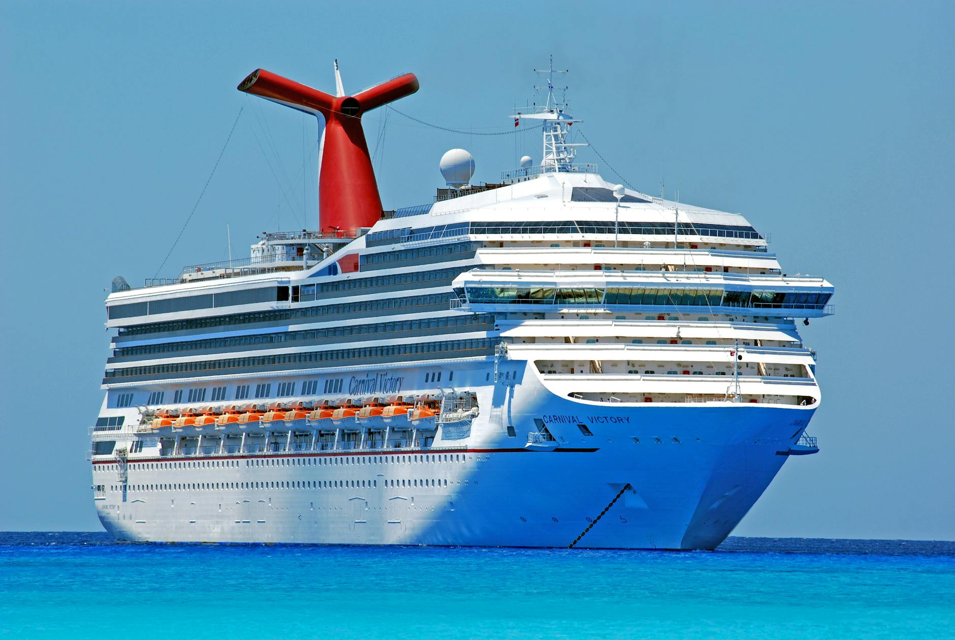 white red and orange cruiser ship on body of water during daytime